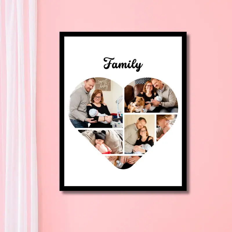 Close up of framed family photo collage in the shape of a heart with the word family written at the top. The frame is hung on a warm pink wall and a sheer white curtain is hanging to the left of the photo collage.