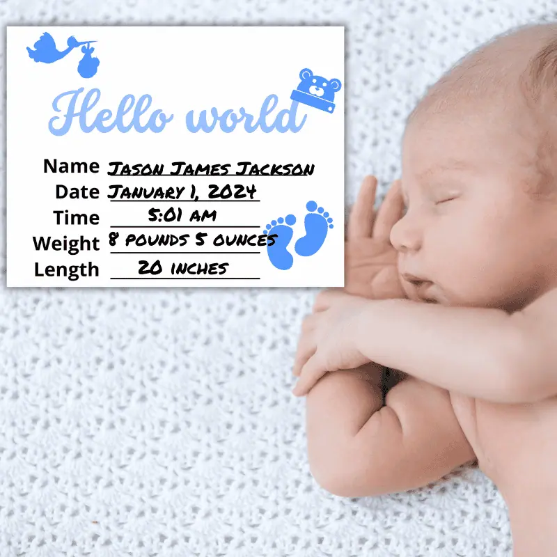 A baby milestone sign that says hello world and has a blue baby hat in the shape of a teddy bear hanging off of the d set next to a newborn in her crib. The sign features the baby's name, date and time of birth, weight and length.