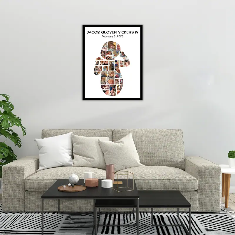 A large poster of a baby photo collage in the shape of a baby hanging on the wall above a couch