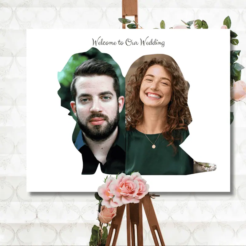 A wedding day photo collage with a picture of the bride and groom inside the shape of a wedding couple. The collage is standing on an easel with flowers on it.