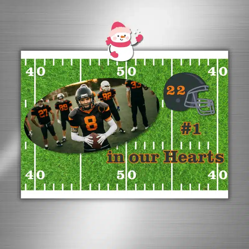 a football themed photo card hanging on a fridge customized with the local team's colors.