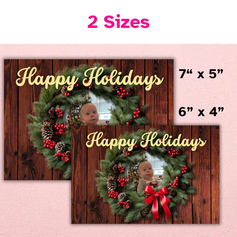 A holiday photo card that comes in two sizes: 7 x 5 inch and 6 x 4 inch. The card has photo of a baby peaking out from the middle of the wreath