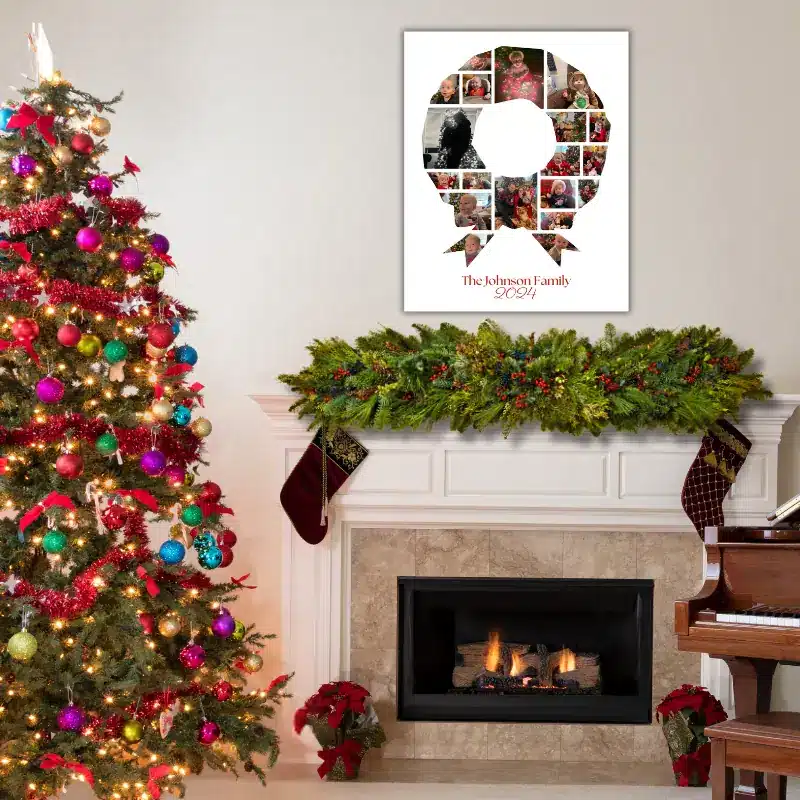 A Christmas photo collage in the shape of a wreath, filled with photos of a baby's first Christmas hanging on the wall above a fireplace decorated for Christmas. There is a large Christmas tree to the left.