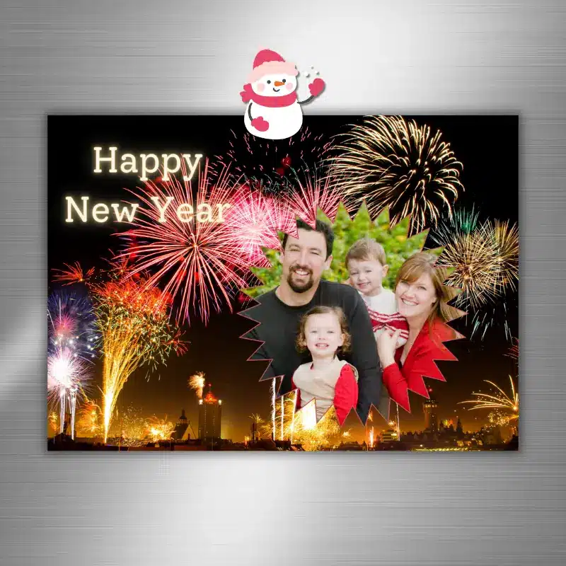 Happy New Year Photo Card with vibrant fireworks behind a medallion shaped family photo featured on a fridge with a snowman magnet.
