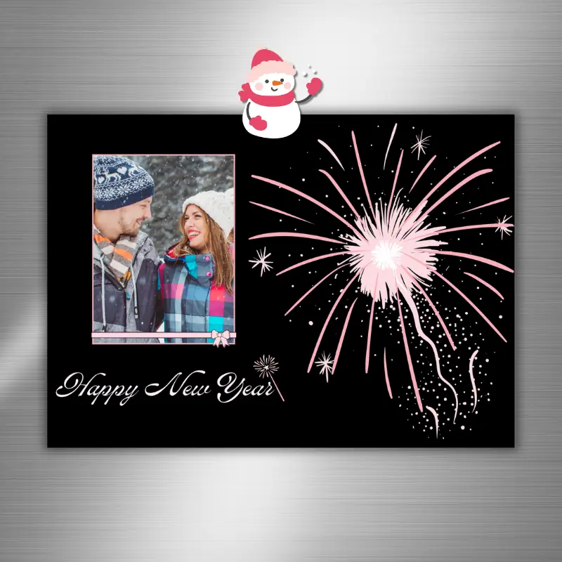 Happy New Year photo card with pink fireworks against a black background featuring a photo of happy friends hanging on a fridge with a snowman magnet.