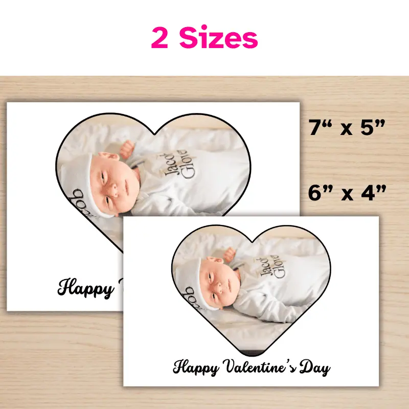 2 of the same photo card displayed in 2 sizes. One 7 x 5 inch and one 6 x 4 inch. The card has a rounded heart with a photo of a new baby inside and says Happy Valentine's Day.